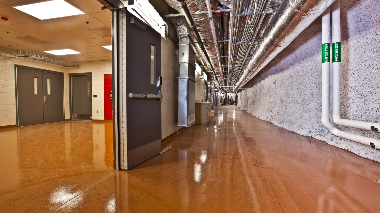 The floor of this corridor is covered in epoxy.
