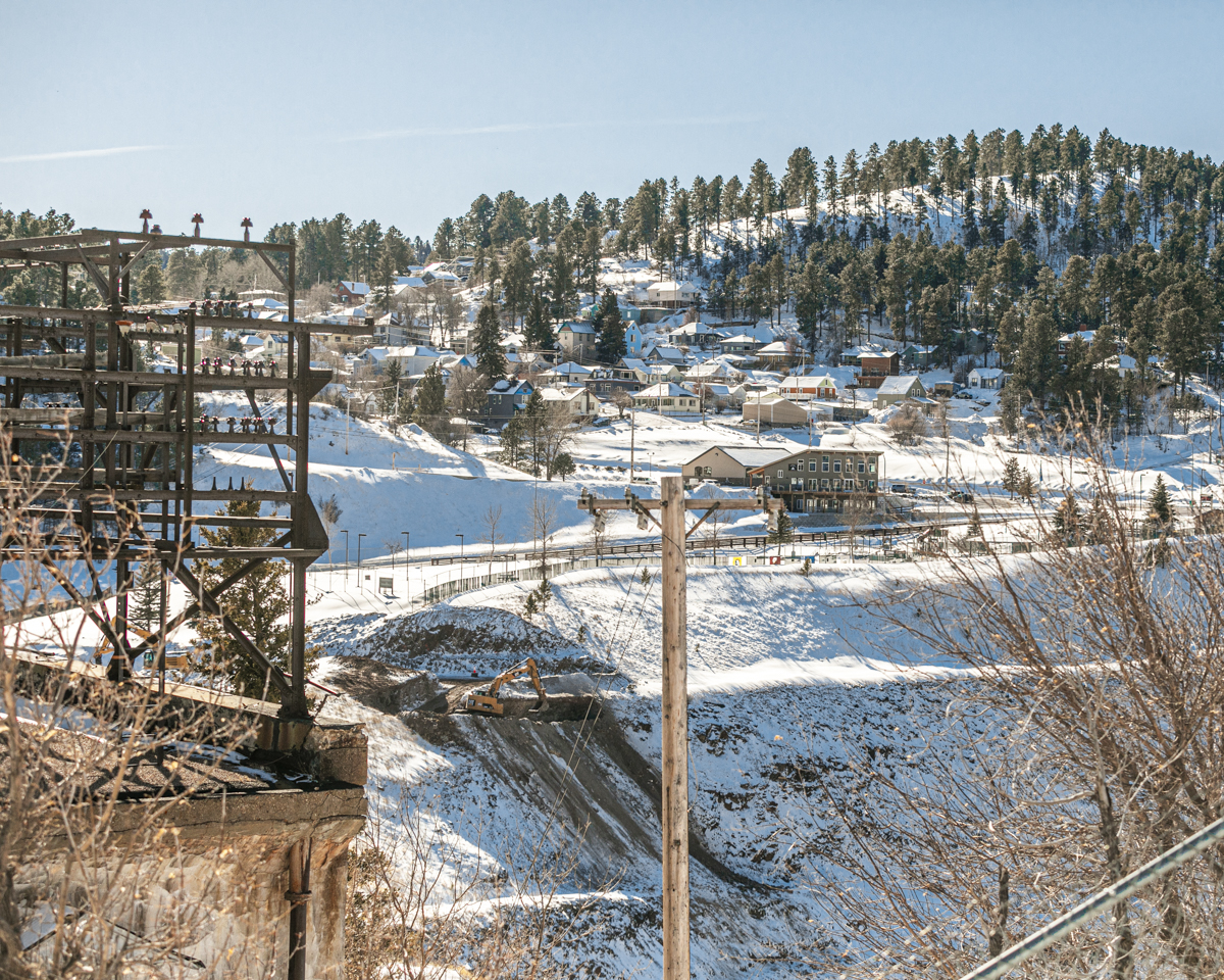 An excavator sits along the Open Cut berm