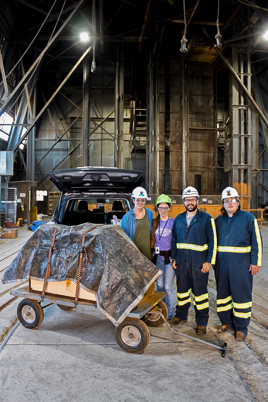 Researchers arrive at the top of the Yates Shaft, ready to move germanium detectors underground. Left to right: Morgan Clark, Anna Reine, Jared Thompson and Brandon DeVries Photo courtesy Jaret Heise