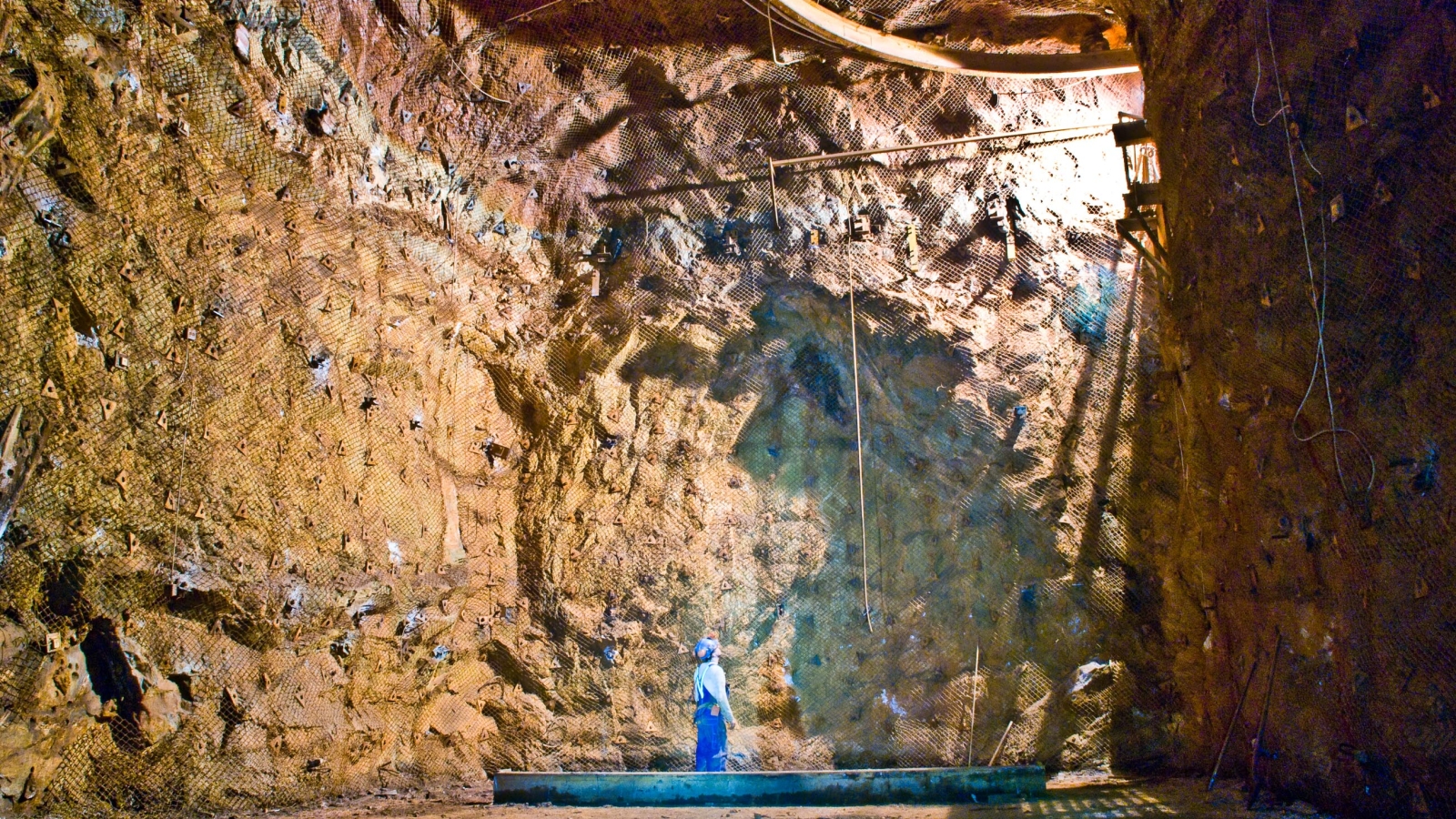 An engineer examines the empty Davis Cavern. 