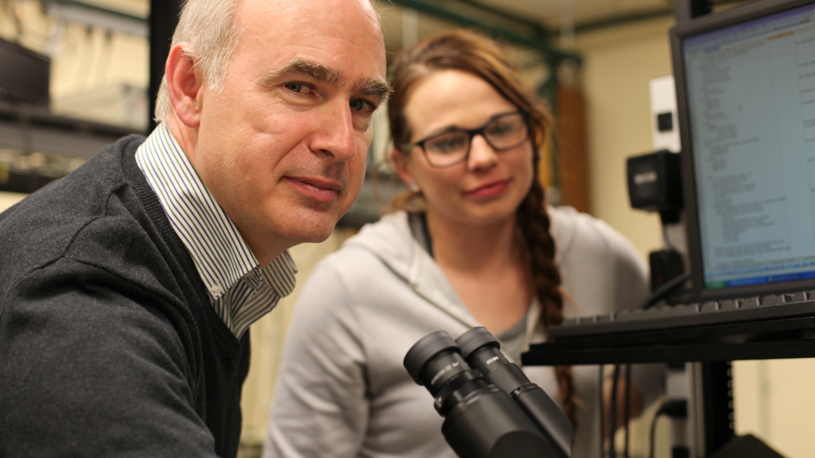 Steve Smith, professor and director of Nanoscience and Nanoengineering at the SD Mines, works with student Laura Brunmaier.
