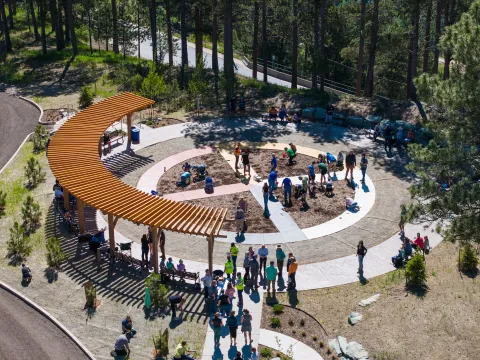 A group gathered at the Garden planting event at Čhaŋgléška Wakȟáŋ.
