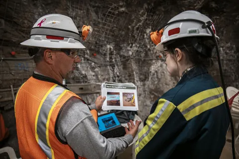Peter Girtz trains a facility guide on new Refuge Chamber procedures. Photo by Nick Hubbard.