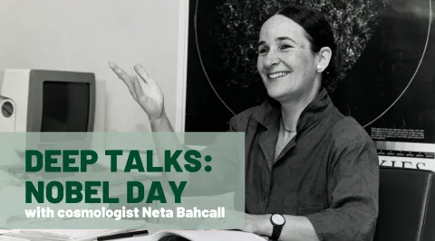 Black and white photo of Neta Bahcall sitting at her desk. The words "Deep Talks: Nobel Day" are superimposed. 