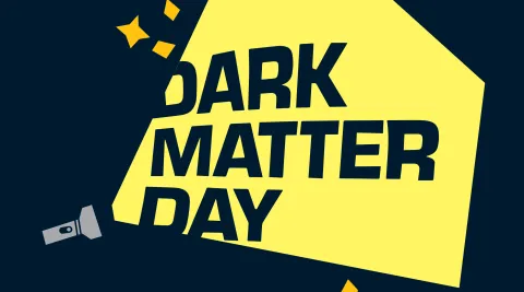 graphic: the words "dark matter day" are lit up by a flashlight 